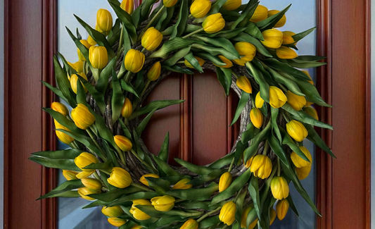 Handmade door wreath with yellow tulips and green leaves, perfect for summer door decor and home decoration.
