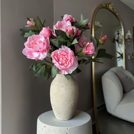 Luxury silk peony bouquet with soft pink peony flowers and realistic green leaves styled in a ceramic vase, elegant artificial flower bouquet for home decor, interior styling, and timeless floral decoration.