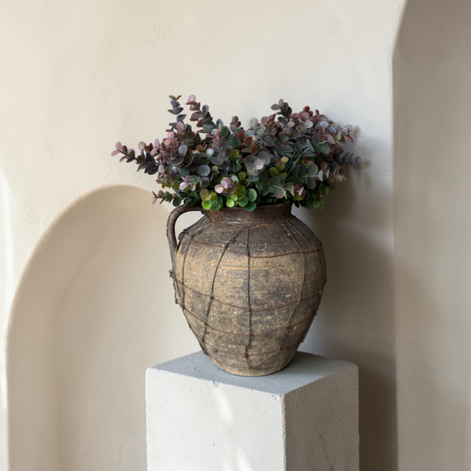 Dusky Eucalyptus Bouquet, a luxury silk eucalyptus bouquet with muted green and soft burgundy tones styled in a rustic earthenware vase