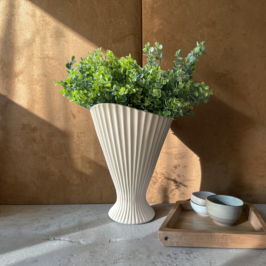 Fresh Greenery Bouquet, a luxury silk boxwood bouquet with realistic green stems styled in a white fluted vase on a stone table in warm natural light