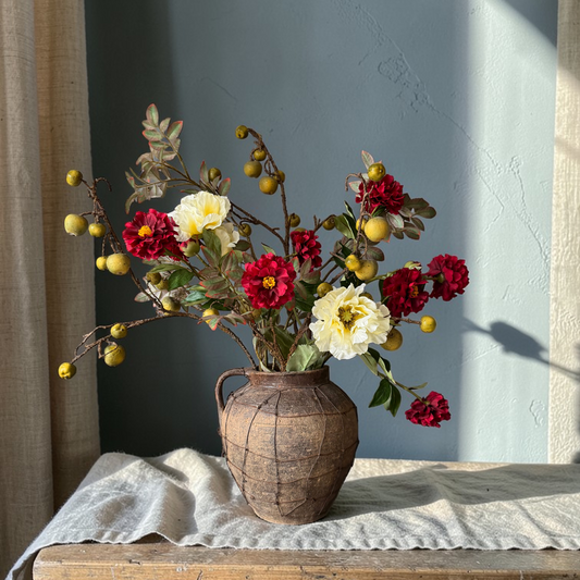 Rustic Apple Bouquet, a luxury silk flower bouquet with deep red blooms, soft yellow papavers, decorative apple stems and natural-looking branches styled in a vase