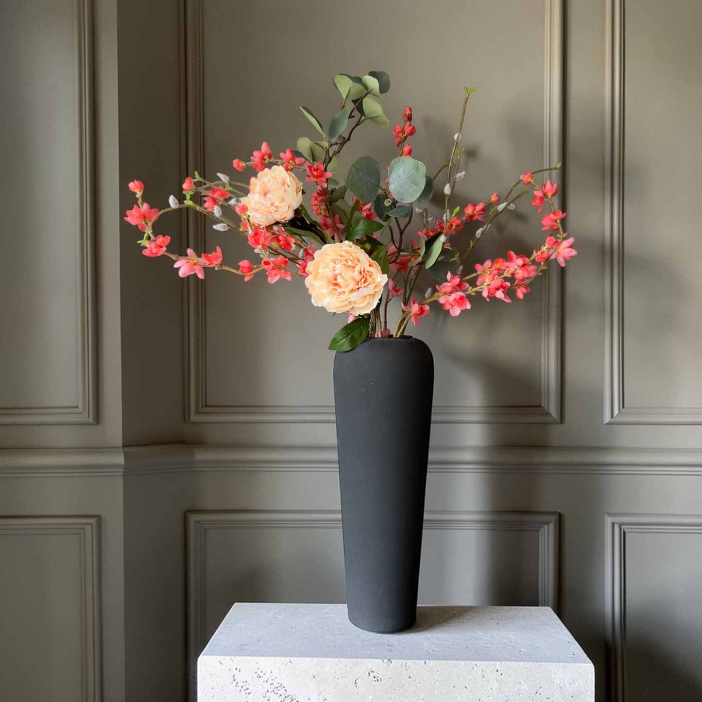 Luxury Peach Bloom silk flower bouquet with peach garden roses, coral blossoms and eucalyptus in a modern black vase for timeless home decor.