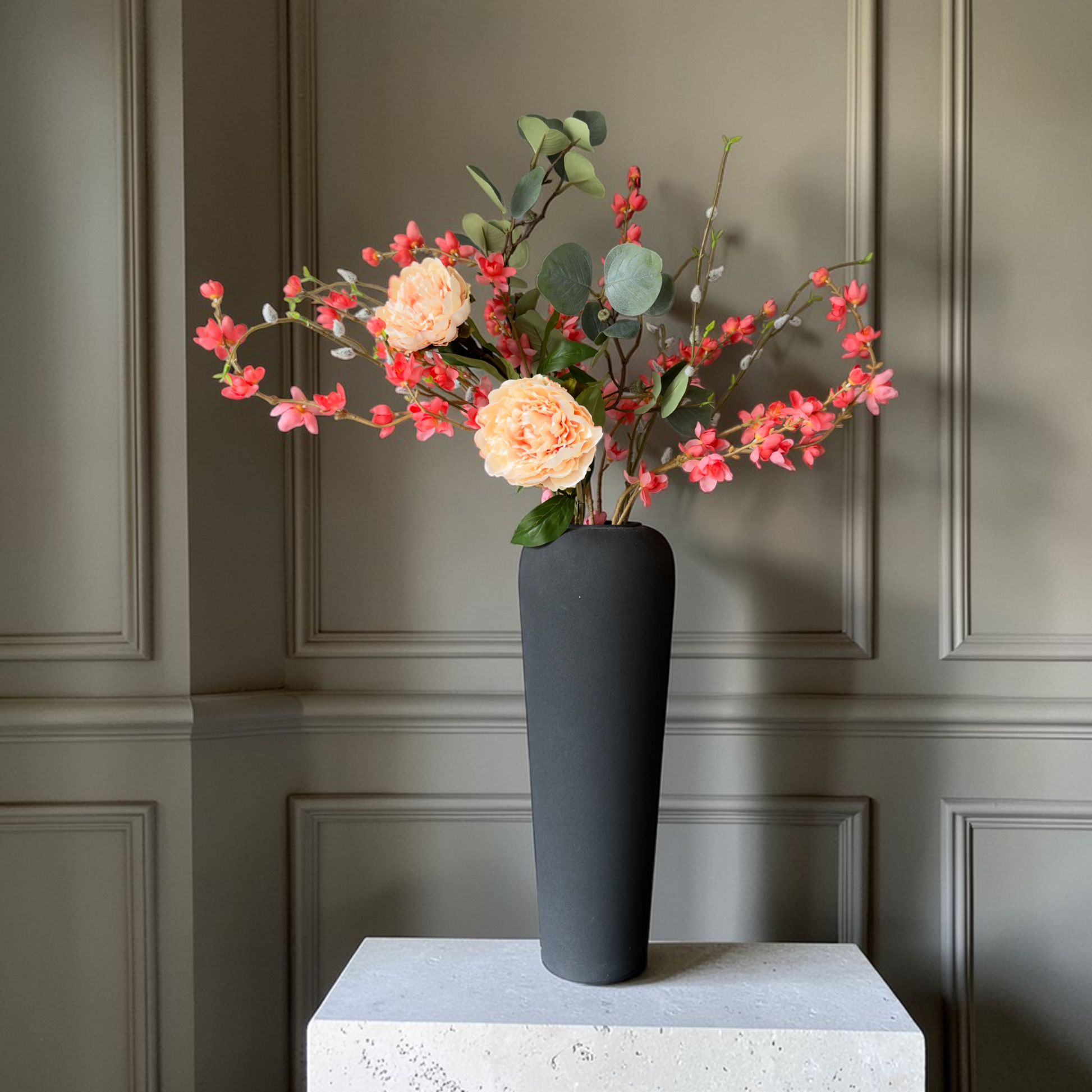 Luxury Peach Bloom silk flower bouquet with peach garden roses, coral blossoms and eucalyptus in a modern black vase for timeless home decor.