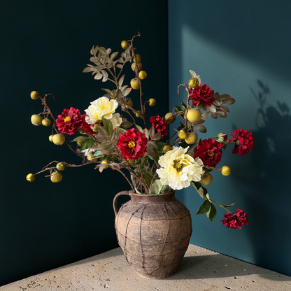 Rustic Apple Bouquet, a luxury silk flower bouquet with deep red blooms, soft yellow papavers, decorative apple stems and natural-looking branches styled in a vase